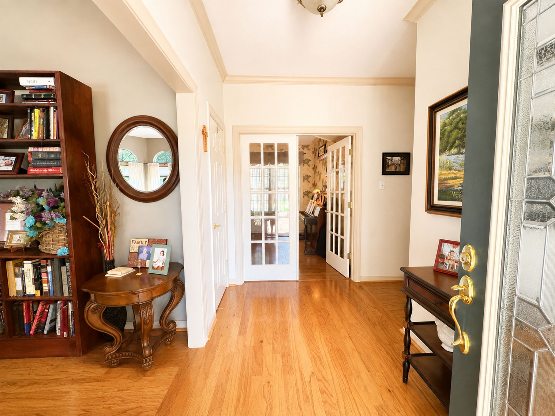 Foyer entrance leading into living room and office.